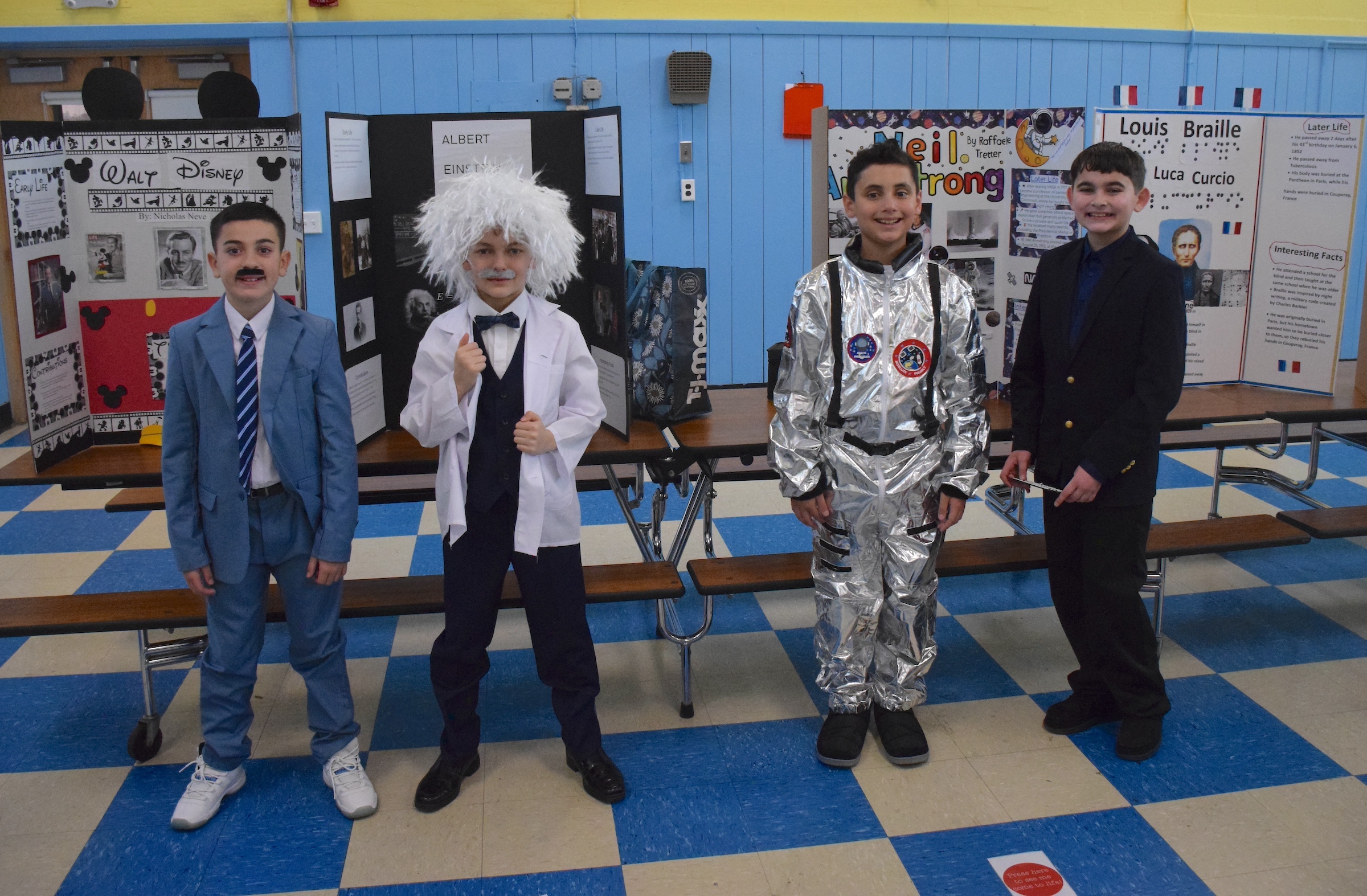 kids in costume standing in front of reports